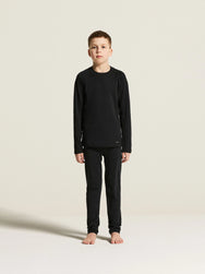Zwart | voor | Vooraanzicht op model, shirt en broek, zwart – Craft thermoset kinderen shirt en broek - Thermal Baselayer