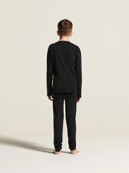 Zwart | achter | Achteraanzicht op model met shirt, zwart – Craft thermobroek kinderen - Thermal Baselayer JR