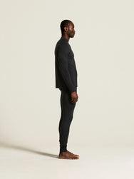 Zwart | zij | Zijaanzicht op model, zwart – Craft merino wollen thermobroek heren - Wool Comfort