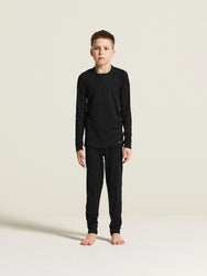 Zwart | voor | Vooraanzicht op model, shirt en broek, zwart – Craft thermoset kinderen shirt en broek - Baselayer Set 2